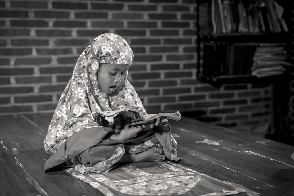 Muslim student learning Quran online with a teacher
